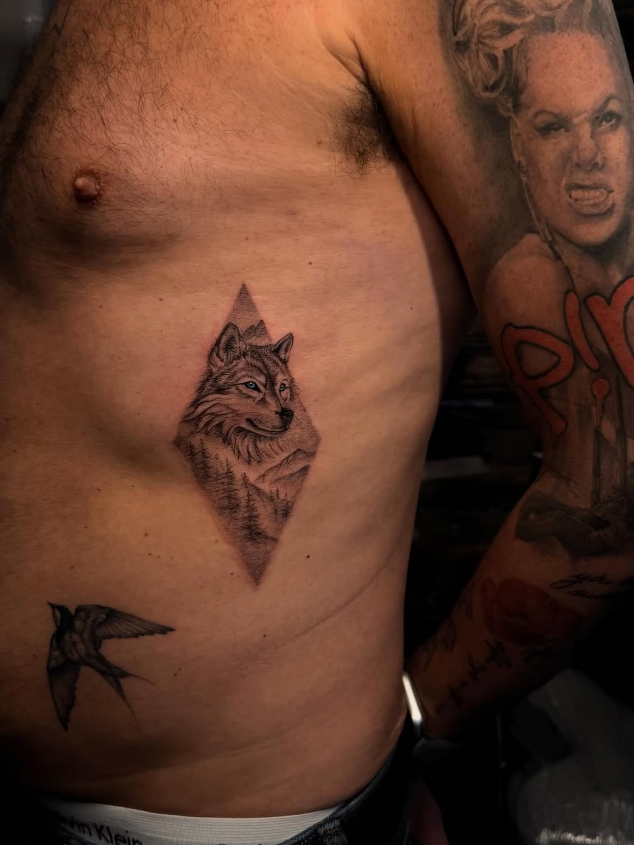Untamed — black-and-grey wolf tattoo by Jason Chamberlain