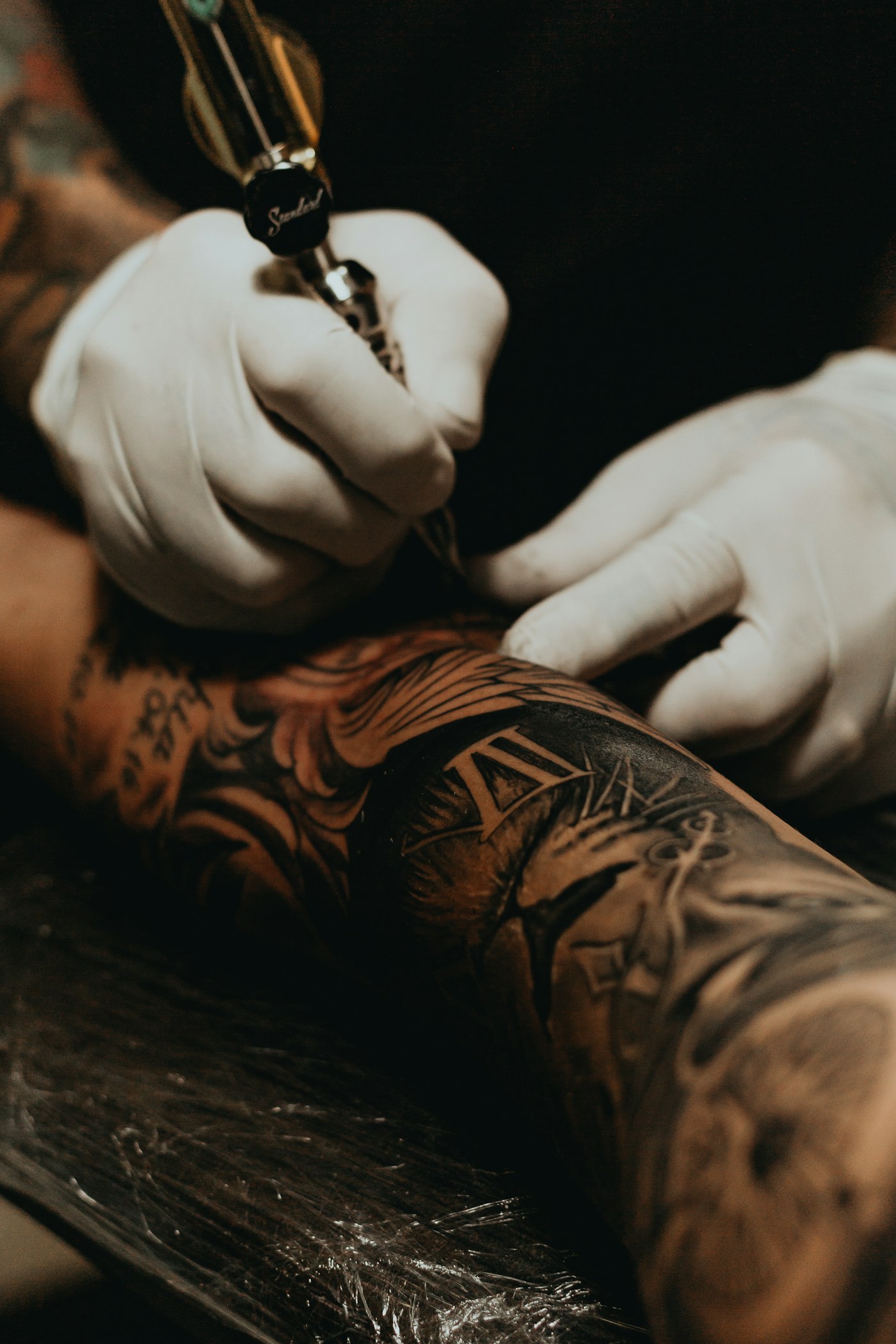 Tattoo artist working in a private studio